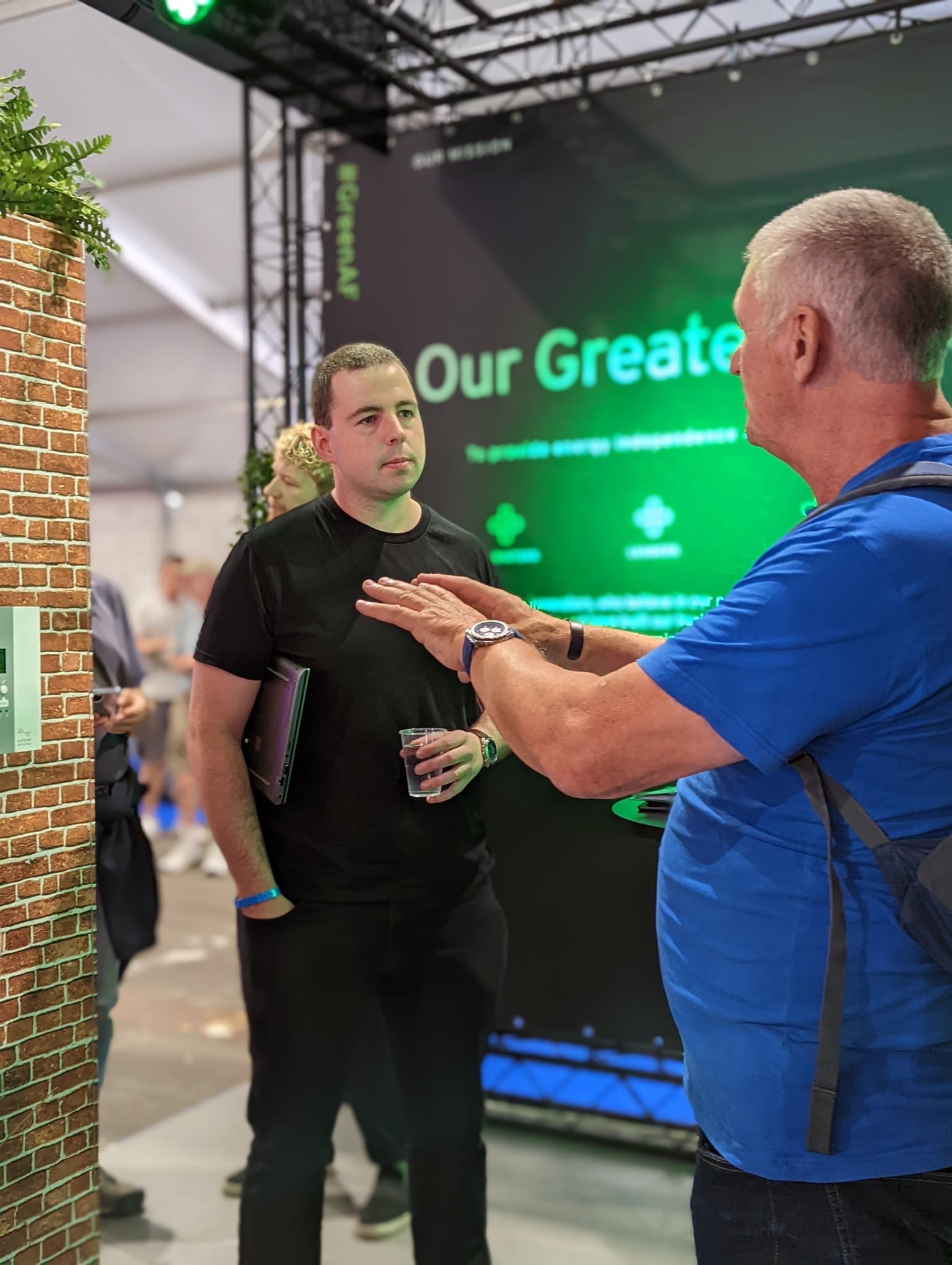 An image of the myenergi team talking to a visitor at our stand 